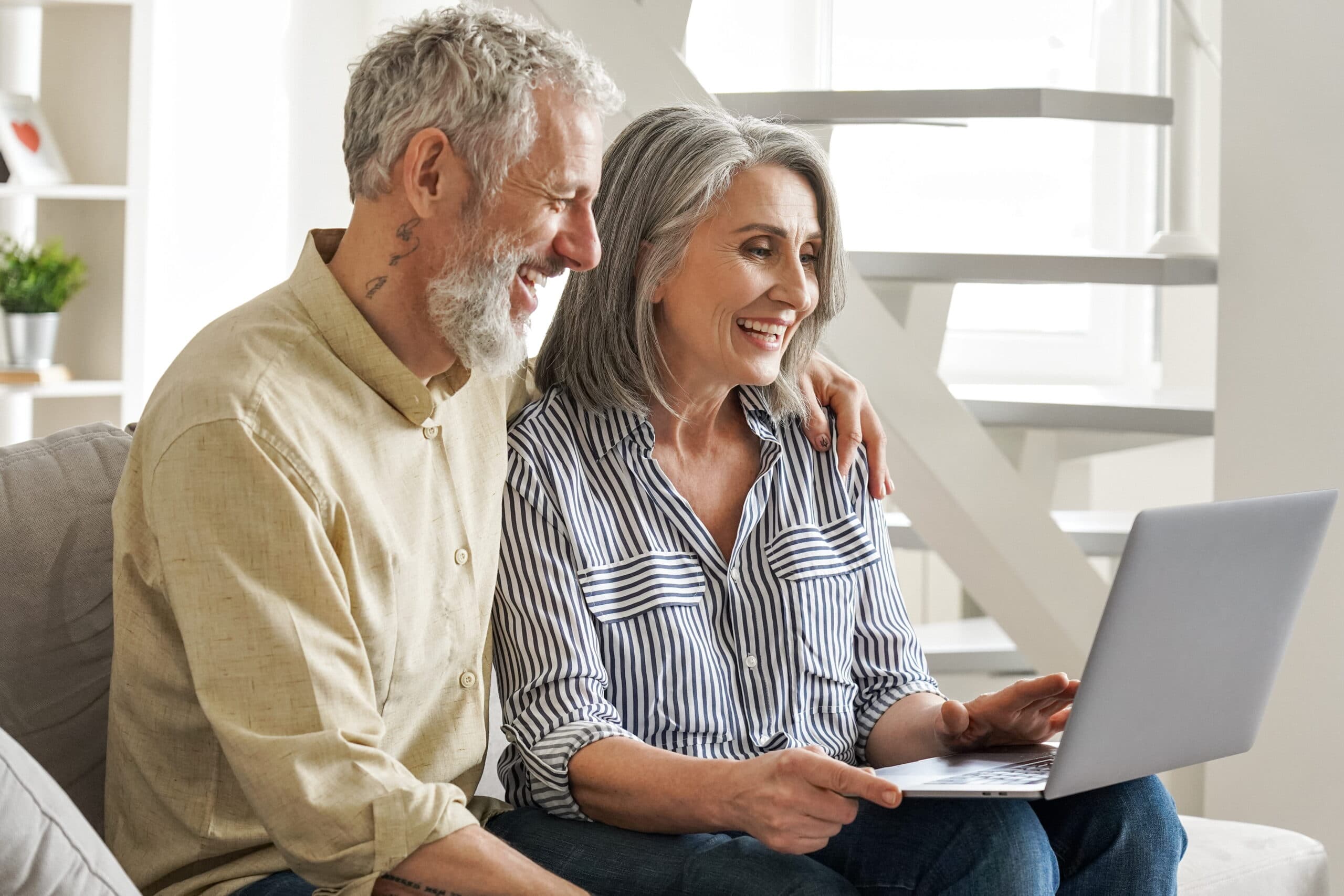 An older couple reviewing chronic care information together.